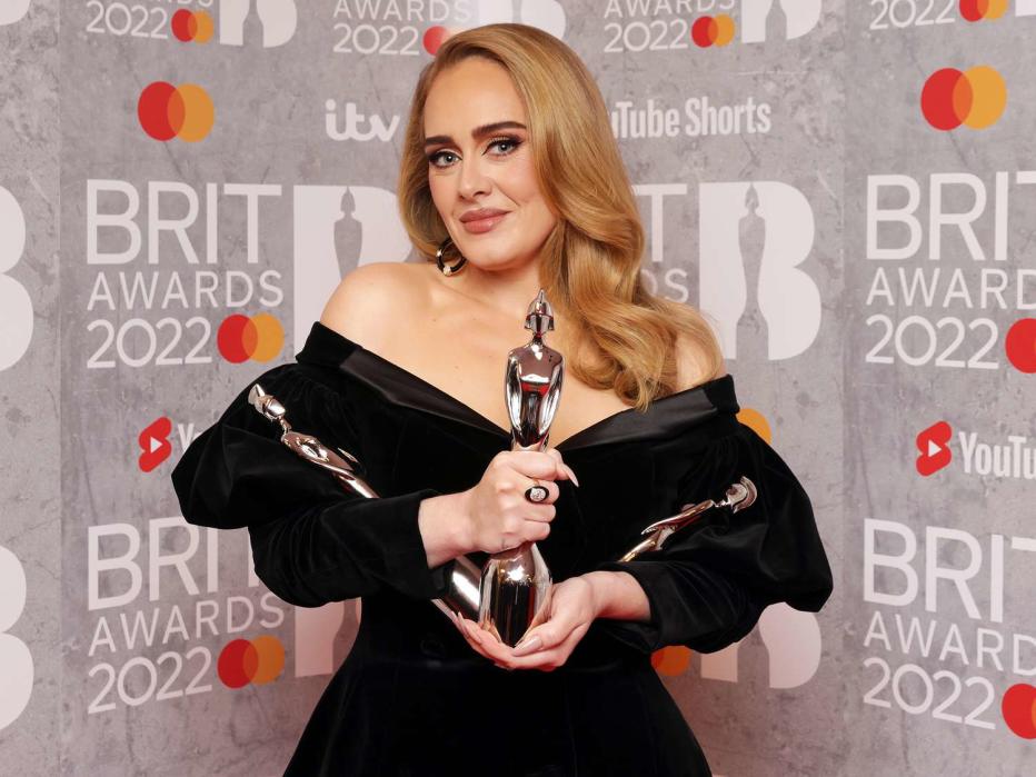 Adele poses with her awards for Song of the Year, Artist of the Year, and Album of the Year in the media room during The BRIT Awards 2022 at The O2 Arena on February 08, 2022 in London, England