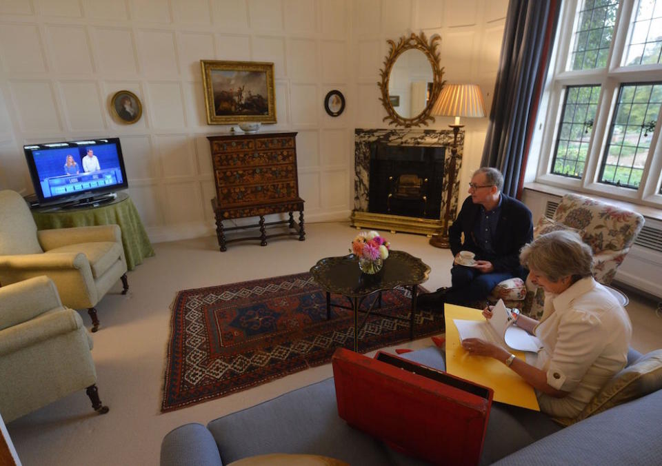 Mrs May and her husband Philip watching ‘The Chase’ at Chequers during filming of the BBC Panorama show (Picture: BBC/PA)