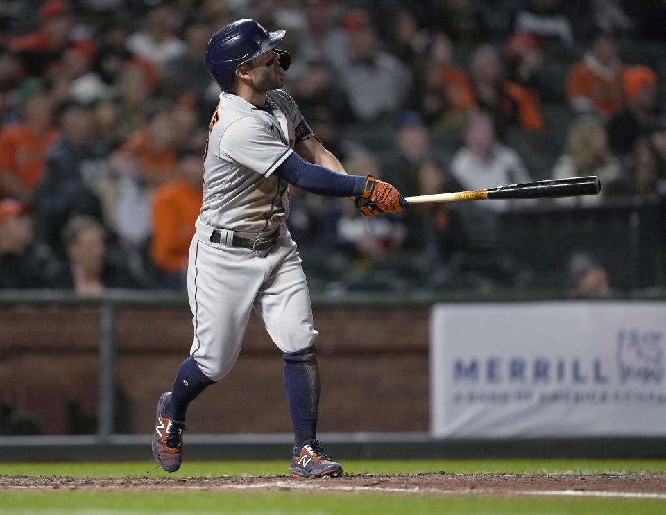 Houston Astros' Jose Altuve watches his grand slam against the San Francisco Giants during the sixth inning of a baseball game Friday, July 30, 2021, in San Francisco. (AP Photo/Tony Avelar)