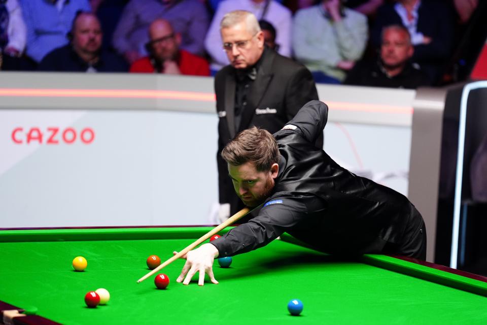 Jak Jones bridges over a red to the cue ball (Mike Egerton/PA Wire)