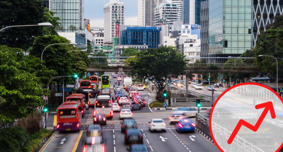 Vehicles in downtown Singapore during rush hour, illustrating a story on COE prices.