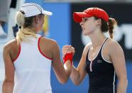 Alize Cornet of France (R) shakes hands with Denisa Allertova of the Czech Republic after defeating her in their women's singles second round match at the Australian Open 2015 tennis tournament in Melbourne January 22, 2015. REUTERS/Carlos Barria (AUSTRALIA - Tags: SPORT TENNIS)