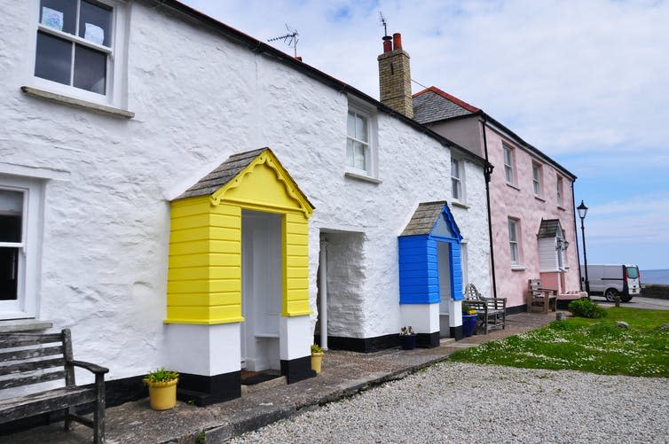 Two seaside holiday rental properties, with colourful front porches