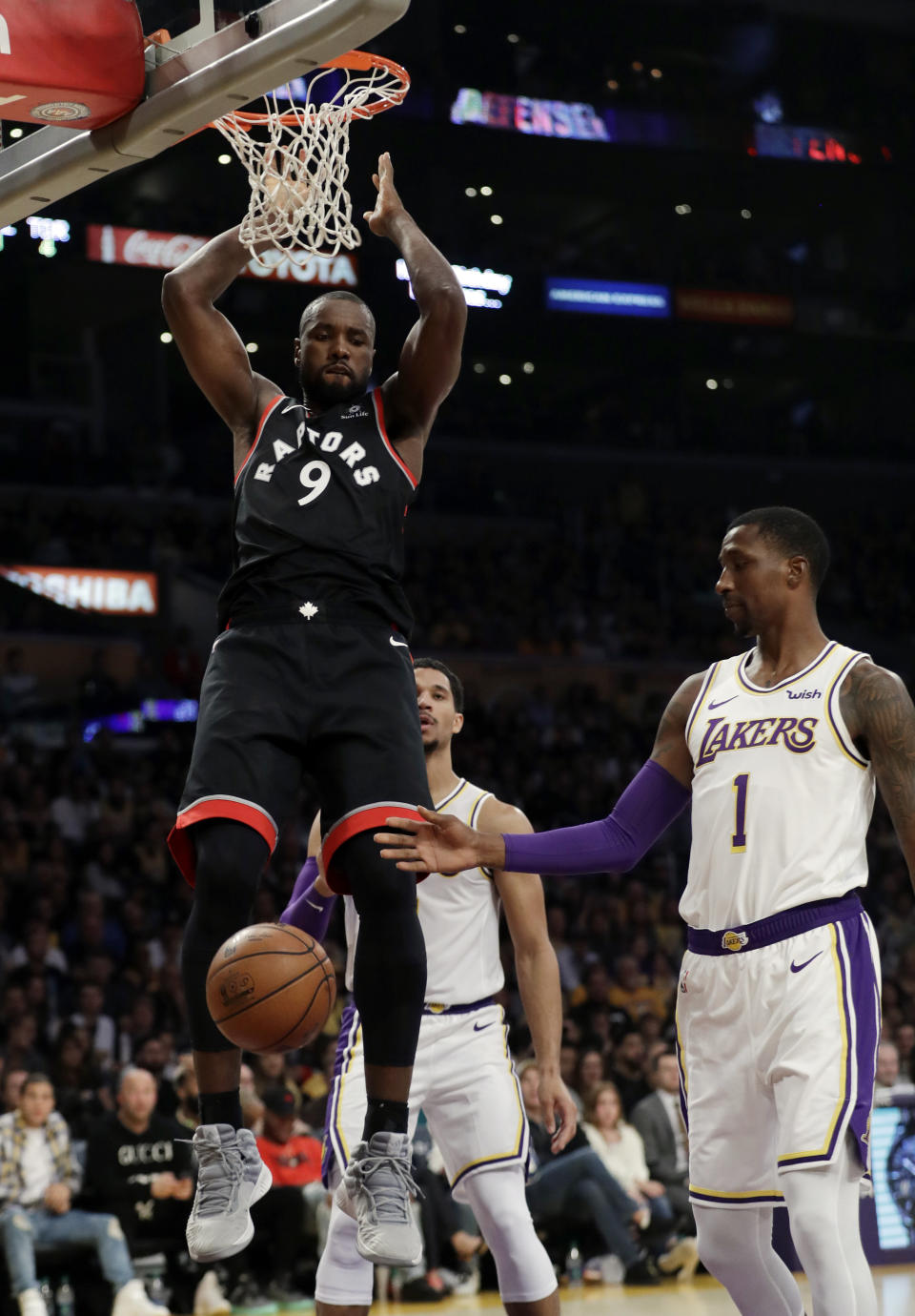 Toronto Raptors' Serge Ibaka (9) dunks against the Los Angeles Lakers during the second half of an NBA basketball game Sunday, Nov. 4, 2018, in Los Angeles. (AP Photo/Marcio Jose Sanchez)