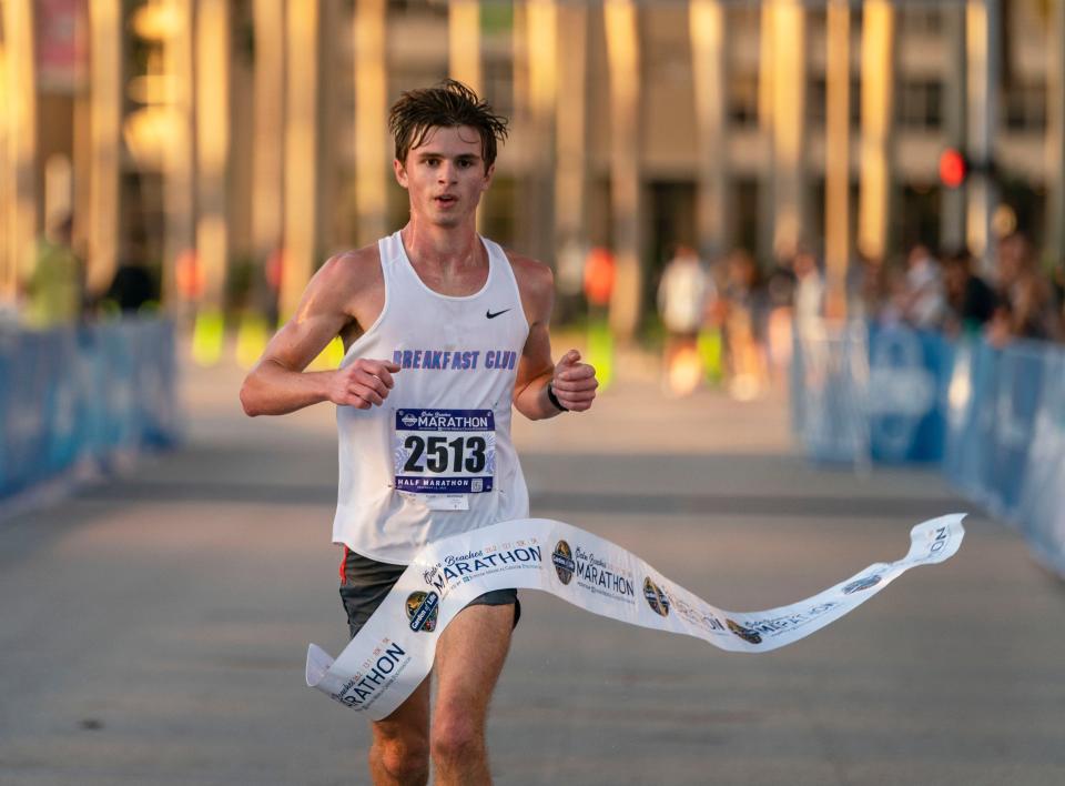 Colton Lawson finishes first in the Men's half marathon The Garden of Life Palm Beaches Marathon on Flagler Drive in West Palm Beach, Florida on December 12, 2021.