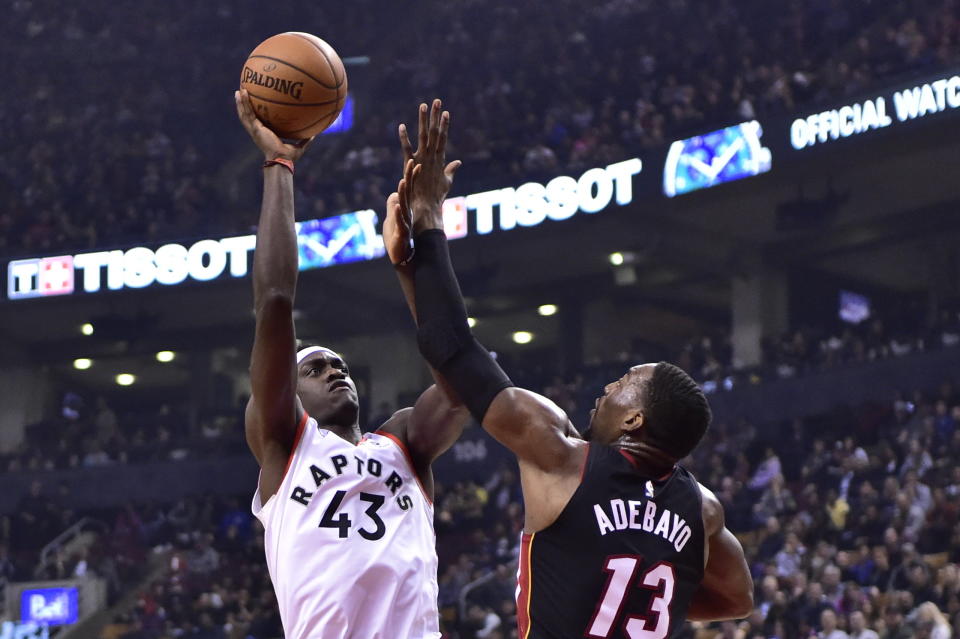 Toronto Raptors forward Pascal Siakam (43) shoots over Miami Heat center Bam Adebayo (13) during first-half NBA basketball action in Toronto, Sunday, April 7, 2019. (Frank Gunn/The Canadian Press via AP)