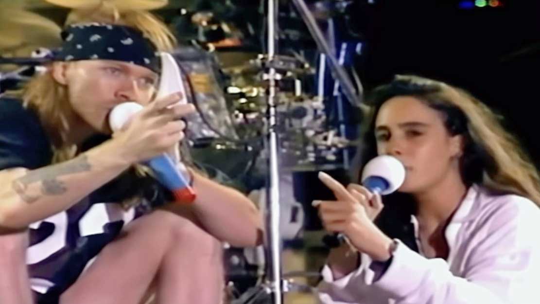  Axl Rose and translator onstage. 