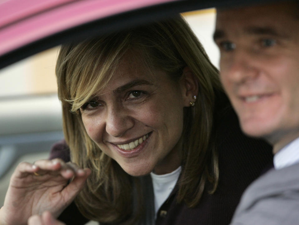 In this Nov. 2, 2005 file photo, Spain's Princess Cristina, left waves beside her husband Inaki Urdangarin from a car in Madrid, Spain. In an unprecedented court appearance on Saturday Feb. 8, 2014 for a direct descendent of a Spanish king, Princess Cristina will answer questions from a judge who has formally named her as a fraud and money laundering suspect. The case is a direct offshoot of one led by the same judge in an investigation of her husband Inaki Urdangarin for allegedly using his position as the Duke of Palma to embezzle public contracts via the Noos Institute, a supposedly nonprofit foundation he set up that channeled money to other businesses. Spain’s royal family just wants the case that has now dragged on for years to end rapidly so the monarchy can try to rebuild the trust it once had. (AP Photo/Daniel Ochoa de Olza, File)