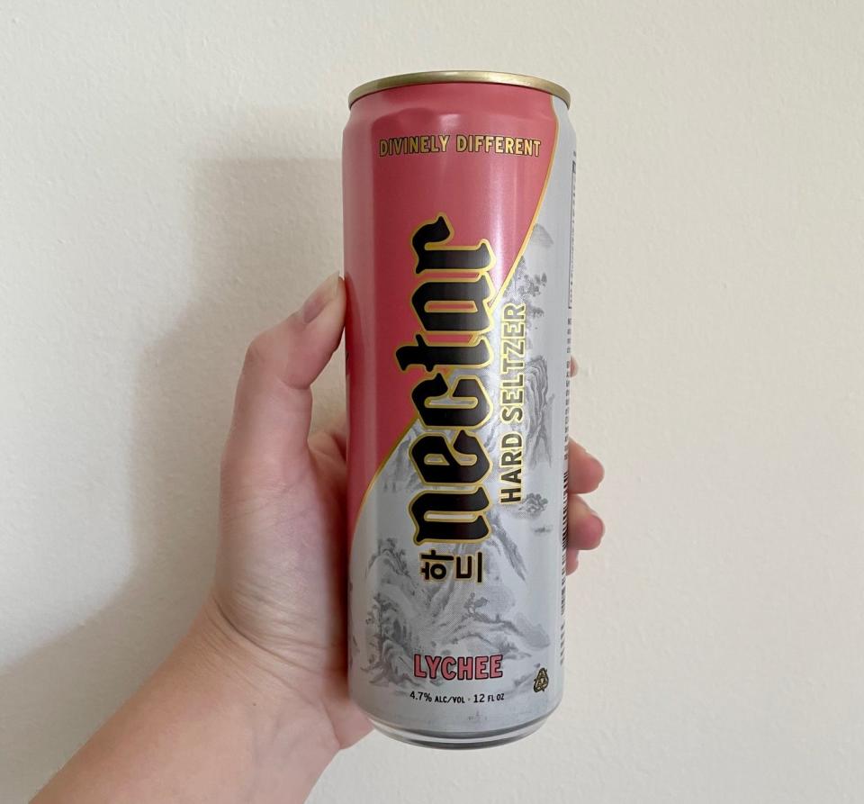 Writer holding can of lychee flavor