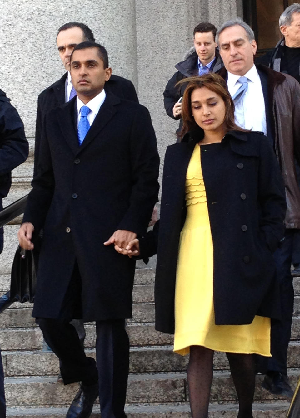 Mathew Martoma, left, leaves federal court in New York City with his wife, Rosemary, Thursday, Feb. 6, 2014, after being convicted of helping his company earn more than a quarter billion dollars illegally through trades based on secrets about the testing of a potential breakthrough Alzheimer's drug. The verdict capped a three-week trial that featured testimony from two prominent doctors who confessed spilling secrets to Mathew Martoma during lucrative consultations with financiers. (AP Photo/Larry Neumeister)