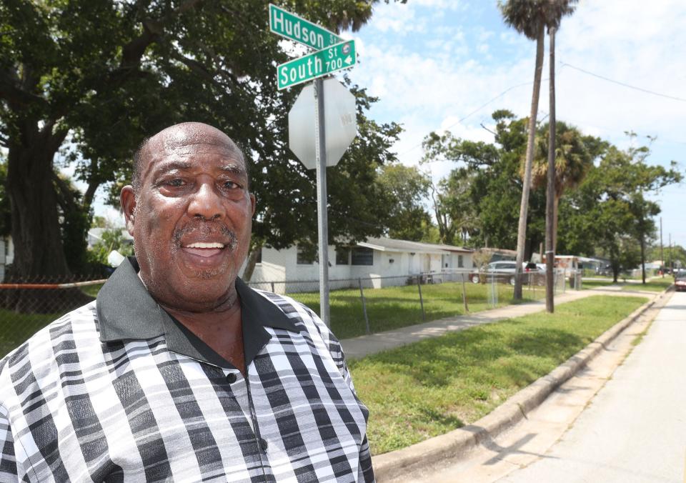 Robert Brown's Hudson Street home in Daytona Beach's Midtown neighborhood has repeatedly been flooded, forcing him to live elsewhere while repairs are made. He's pictured in September 2023 standing on South Street, which was under several feet of flood water a year earlier during Hurricane Ian. Brown's flood-damaged house is in the background.