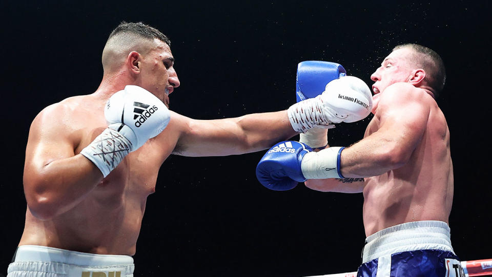 Seen here, Justis Huni punches Paul Gallen during their June fight in Sydney.