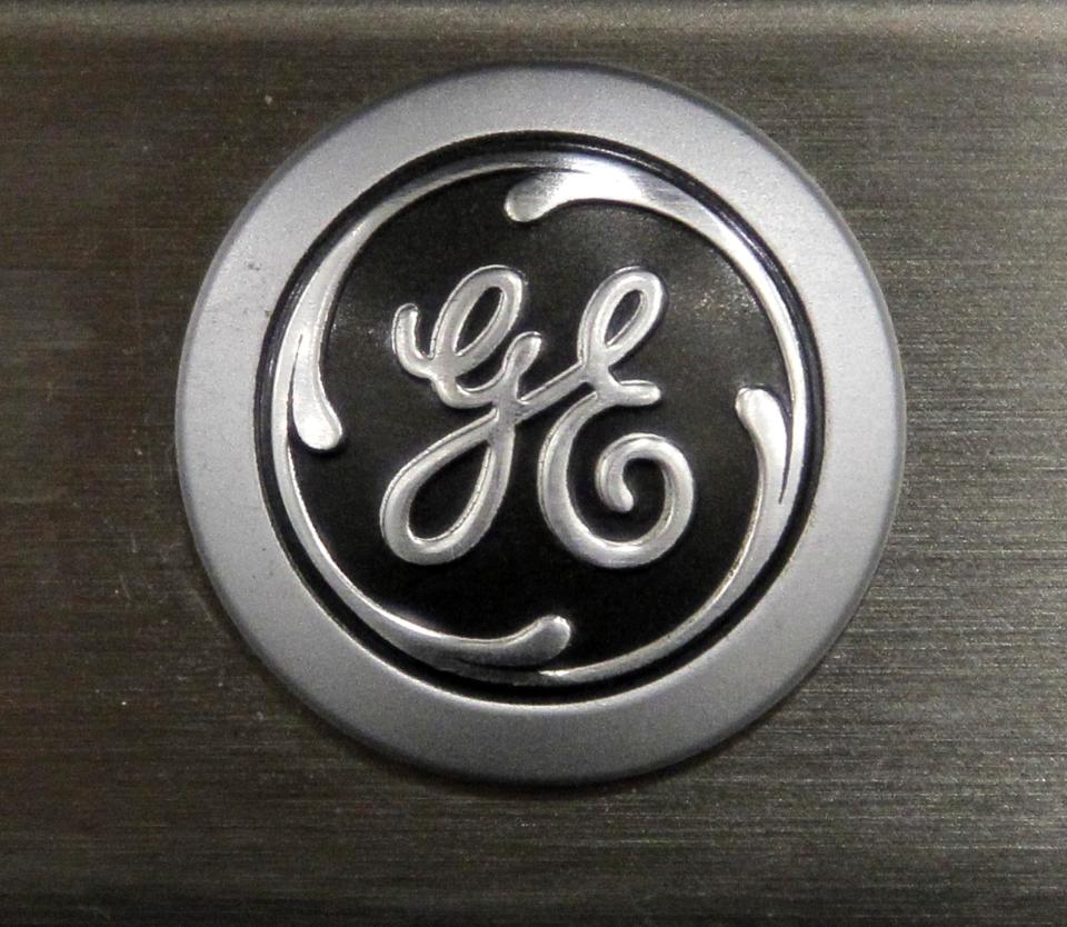 FILE - In this Monday, Sept. 10, 2012 file photo a General Electric logo is seen on a kitchen stove at a Lowe's store in Framingham, Mass. Industrial companies such as General Electric, Honeywell and Caterpillar, which make expensive equipment that other companies need to buy in order to grow, have been posting strong results in recent weeks and telling investors that orders are strong. (AP Photo/Steven Senne, File)