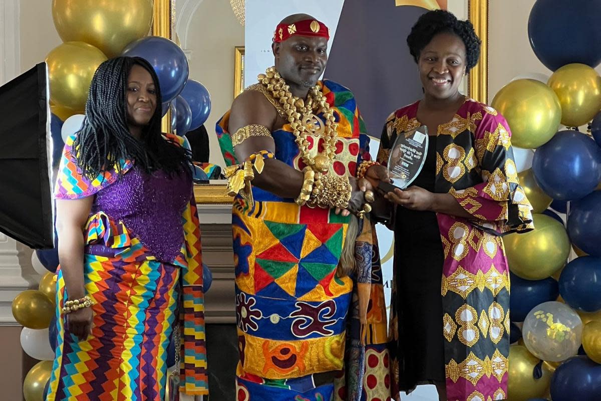 Ghanaian King HRH Nana Odeniho Odoi Awrhireng II presents an award to a winner at the Igniting Dreams Business Expo 2024 at the Midland Hotel <i>(Image: UGC)</i>