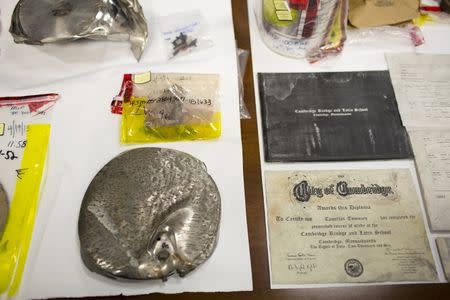 Evidence from the Boston Marathon bombing trial, including a pressure-cooker bomb recovered from the Watertown crime scene and a diploma for Tamerlan Tsarnaev, is seen at the Moakley Federal Courthouse in Boston, Massachusetts March 19, 2015. REUTERS/Dominick Reuter