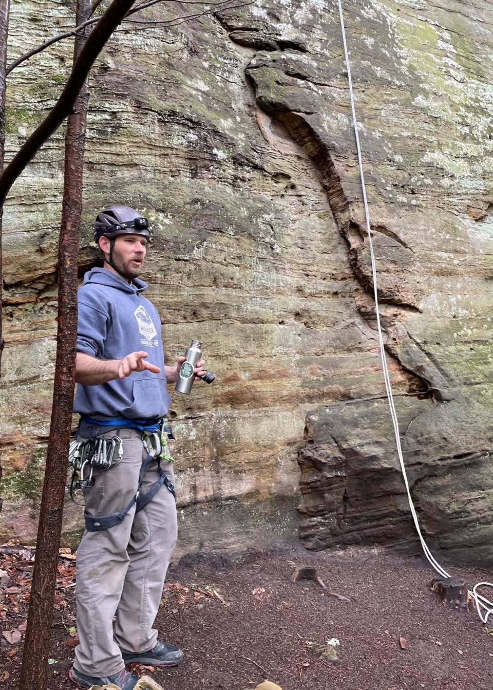 Guide Martin Strange shows guests how to use rappelling gear at High Rock Adventures.