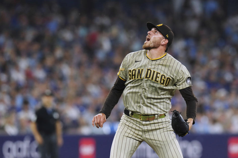 San Diego Padres starting pitcher Joe Musgrove watches a fly ball by a Toronto Blue Jays batter during the sixth inning of a baseball game Tuesday, July 18, 2023, in Toronto. (Chris Young/The Canadian Press via AP)