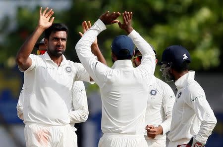 Cricket - Sri Lanka v India - First Test Match - Galle, Sri Lanka - July 29, 2017 - India's Ravichandran Ashwin celebrates with teammates after taking the wicket of Sri Lanka's Niroshan Dickwella (not pictured). REUTERS/Dinuka Liyanawatte