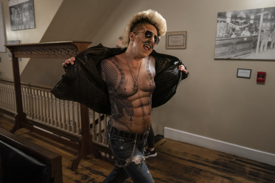 Drag king Xander Valentine, aka Gwen Bobbie, performs during the "Daniels Family Values" drag show at the Heritage Restaurant in Shamokin, Pa., Saturday, April 16, 2022. (AP Photo/Carolyn Kaster)