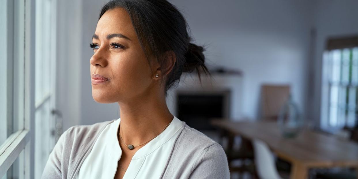 woman looking out window - perimenopause test