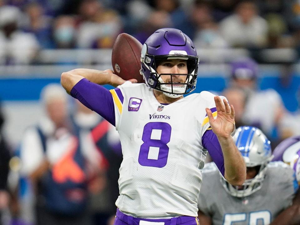 Kirk Cousins makes a pass against the Detroit Lions.