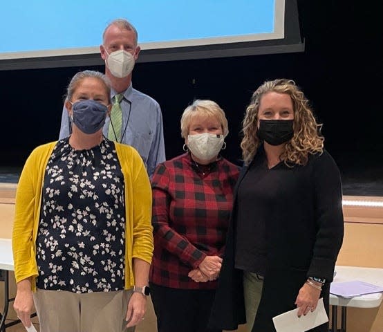Dover High School DHS Principal Peter Driscoll, in back, DHS teacher Amy Poirier, left to right,  SEED reps Deb Fennessey and Natalie Koellmer. Missing is Peter Seekamp.