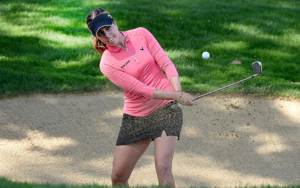 Georgia Hall of England chips out of a bunker on the 18th green - Steve Dykes/Getty Images