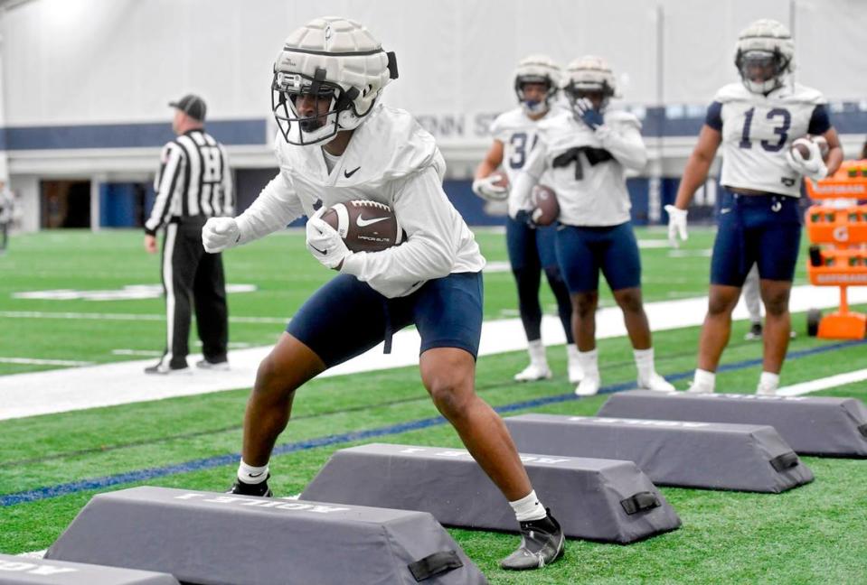 Penn State running back Nick Singleton runs a drill during spring practice on Tuesday, March 14, 2023.