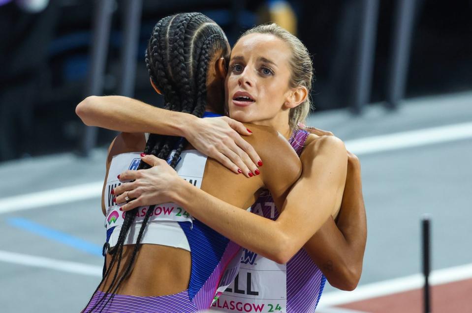 a couple of women hugging