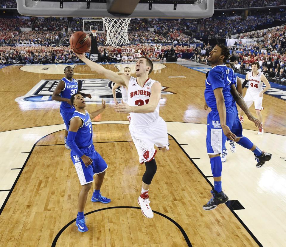 Wisconsin guard Josh Gasser (21) shoots against Kentucky during the first half of the NCAA Final Four tournament college basketball semifinal game Saturday, April 5, 2014, in Arlington, Texas. (AP Photo/Chris Steppig, pool)