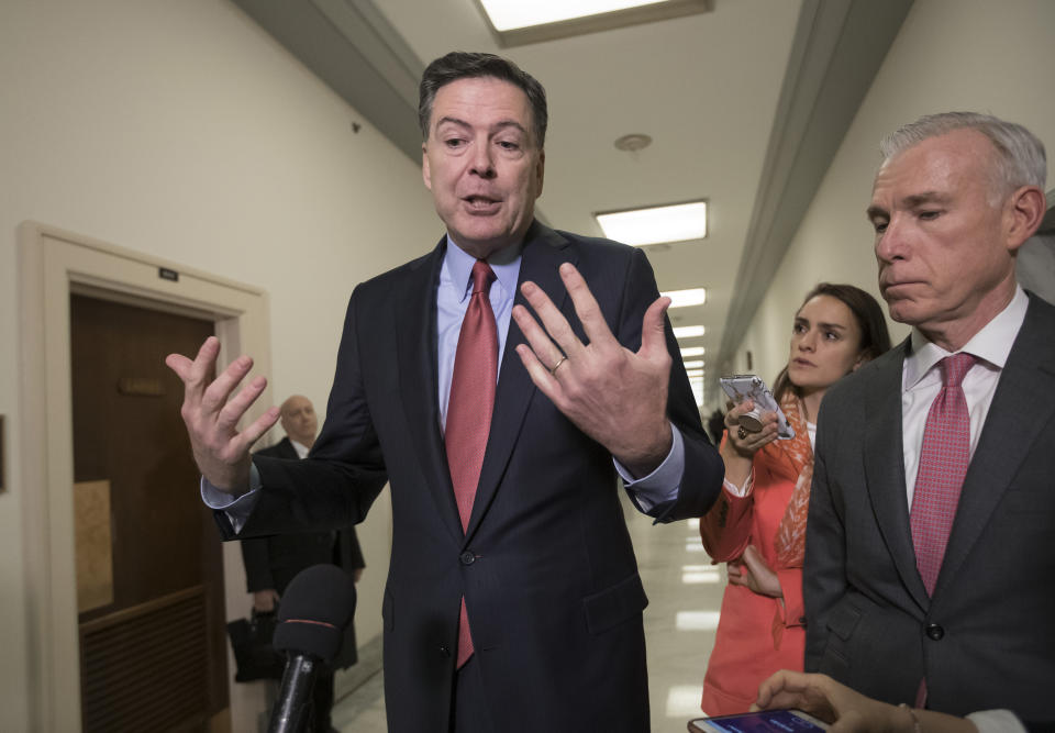 Former FBI Director James Comey, with his attorney, David Kelley, right, speaks to reporters on Capitol Hill Washington, Monday, Dec. 17, 2018, after a second closed-door interview with two Republican-led committees investigating what they say was bias at the Justice Department before the 2016 presidential election. (AP Photo/J. Scott Applewhite)