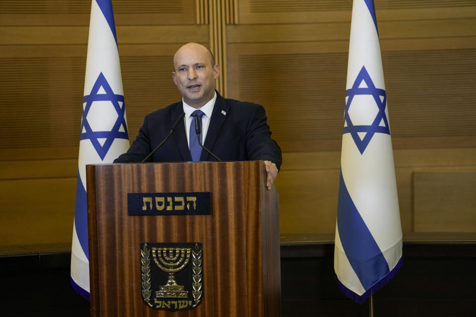 Israeli Prime Minister Naftali Bennett delivers a statement at the Knesset, Israel's parliament, in Jerusalem, Wednesday, June 29, 2022. Bennett will not run in upcoming elections, after he led a broad but fragile coalition government that came unraveled barely a year after taking office. (AP Photo/Tsafrir Abayov)