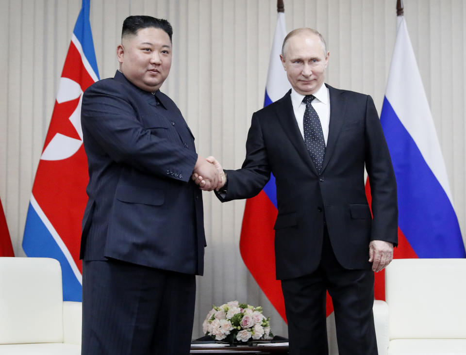 Russian President Vladimir Putin, right, and North Korea's leader Kim Jong Un shake hands during their meeting in Vladivostok, Russia, Thursday, April 25, 2019. Putin sat down for talks Thursday with North Korean leader Kim, saying the summit should help plan joint efforts to resolve a standoff over Pyongyang's nuclear program.(Sergei Ilnitsky/Pool Photo via AP)