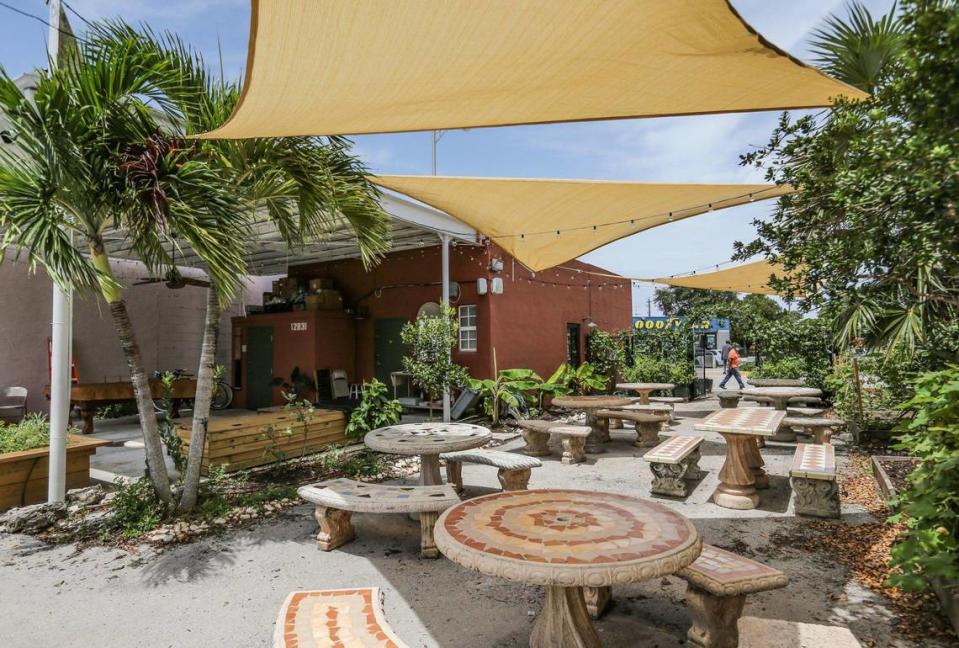 The outdoor courtyard at Paradis Books & Bread includes a pool table and an urban garden.
