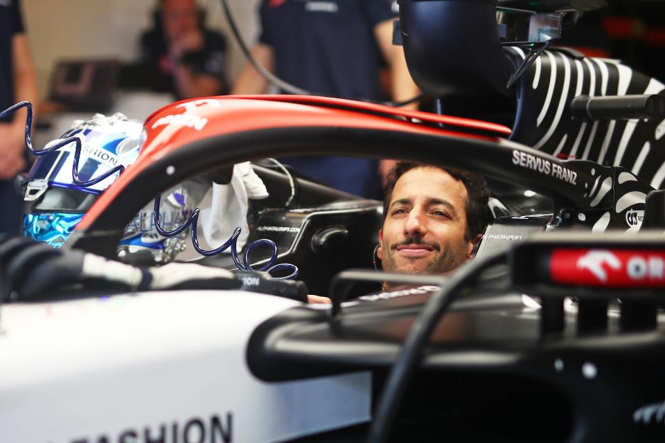 ABU DHABI, UNITED ARAB EMIRATES - NOVEMBER 28: Daniel Ricciardo of Australia and Scuderia AlphaTauri prepares to drive in the garage during Formula 1 testing at Yas Marina Circuit on November 28, 2023. (Photo by Joe Portlock/Getty Images)