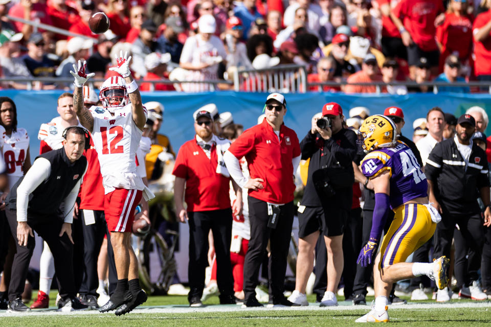 Jan 1, 2024; Tampa, FL, USA; Wisconsin Badgers wide receiver Trech Kekahuna (12) catches a pass during the first half against the LSU Tigers at Raymond James Stadium. Mandatory Credit: Matt Pendleton-USA TODAY Sports