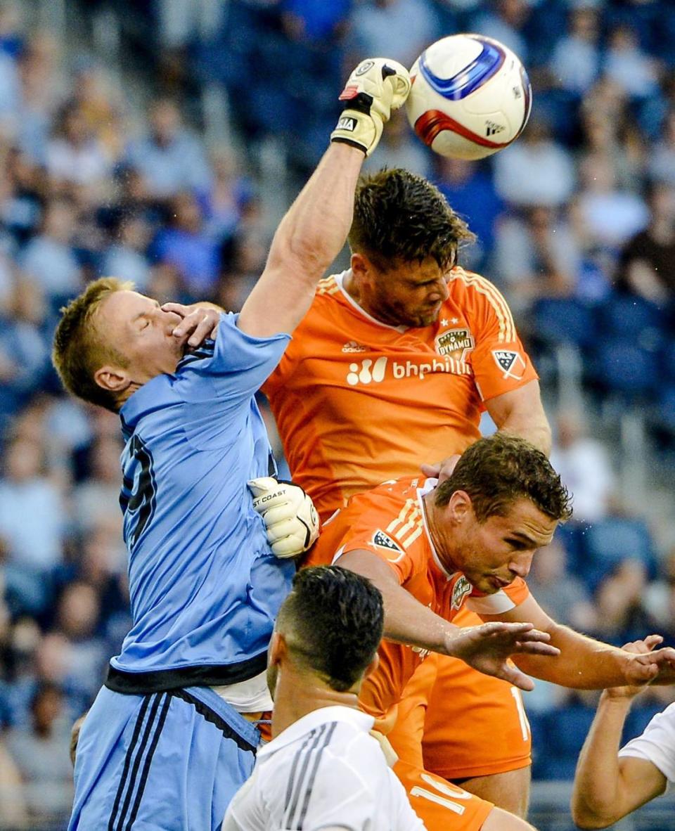 Almost immediately, plays like this one by Sporting Kansas City goal keeper Tim Melia (at left, knocking away a ball against the <a class="link " href="https://sports.yahoo.com/soccer/teams/houston/" data-i13n="sec:content-canvas;subsec:anchor_text;elm:context_link" data-ylk="slk:Houston Dynamo;sec:content-canvas;subsec:anchor_text;elm:context_link;itc:0">Houston Dynamo</a> in 2015) endeared him to KC fans ... and manager Peter Vermes. KC STAR FILE PHOTO