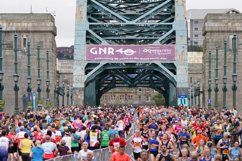 <p>NEWCASTLE UPON TYNE, ENGLAND - SEPTEMBER 12: Runners cross the Tyne Bridge in Newcastle during the 40th Great North Run on September 12, 2021 in Newcastle upon Tyne, England. Approximately 57,000 runners are expected to take part in the marathon to raise money for a variety of different charities. The event, which was cancelled in 2020 due to the COVID-19 pandemic, is being held with several coronavirus safety measure in place, including route changes, staggered start times and hand sanitiser stations. (Photo by Ian Forsyth/Getty Images)</p>
