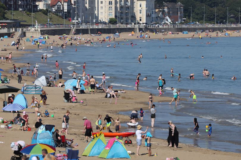 People flock to the beach in Colwyn Bay