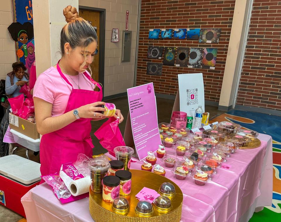 Melody Rodriguez Capellan,16, works her baked goods vendor, Mel's Bakery.