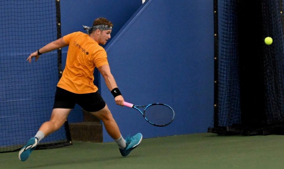 Justin Csepe hits a backhand on the run in winning the men's singles title in the 90th News Journal Tennis Tournament.