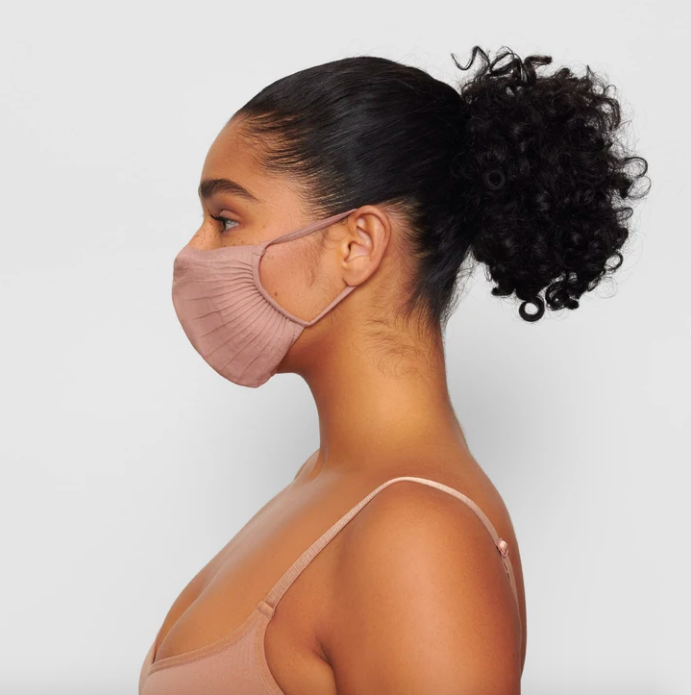 Adult Seamless Knit Face Mask in Sienna. Image via skims.com