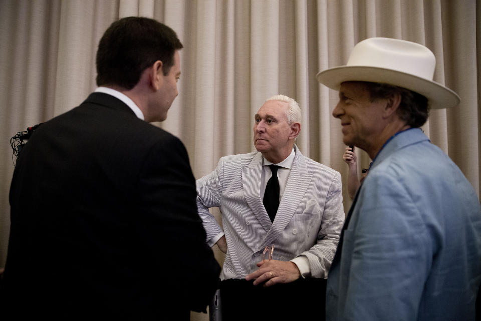 Roger Stone, center, speaks to reporters before the start of a campaign event where Republican presidential candidate Donald Trump will announce Gov. Mike Pence, R-Ind., as his vice presidential running mate on July 16, 2016, in New York. (Photo: Mary Altaffer/AP)