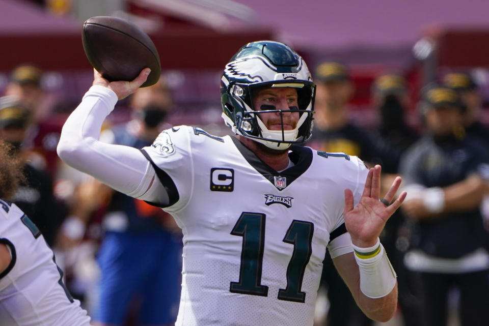 Philadelphia Eagles quarterback Carson Wentz passes the ball against the Washington Football Team during the first half of an NFL football game, Sunday, Sept. 13, 2020, in Landover, Md. (AP Photo/Susan Walsh)