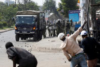 <p>Supporters of Kenyan opposition National Super Alliance (NASA) coalition throw stones at police in Nairobi, Kenya, Nov. 17, 2017. (Photo: Baz Ratner/Reuters) </p>