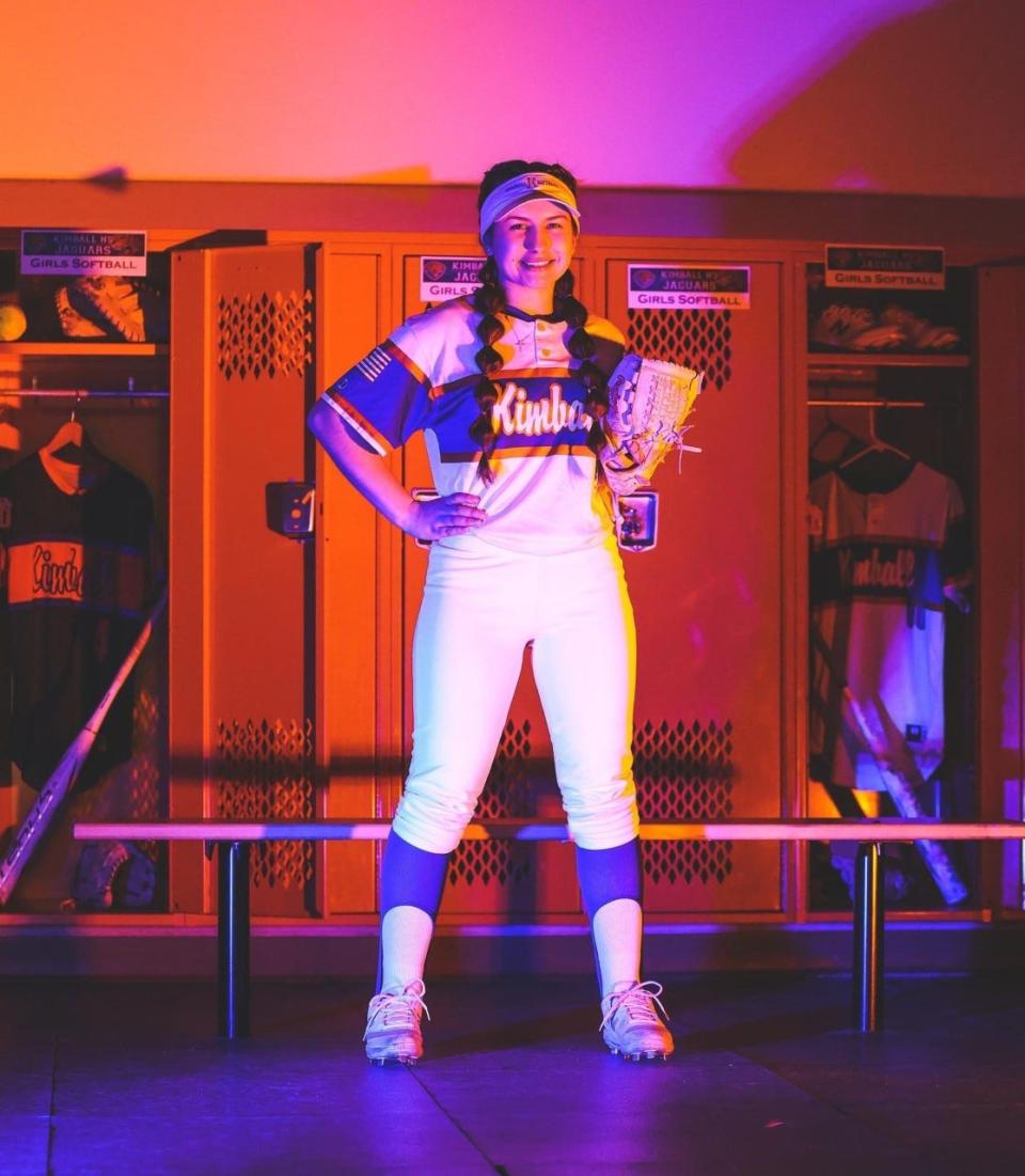 Elysia Duarte, third baseman for Kimball softball poses for a team photo shoot during the 2022-23 season
