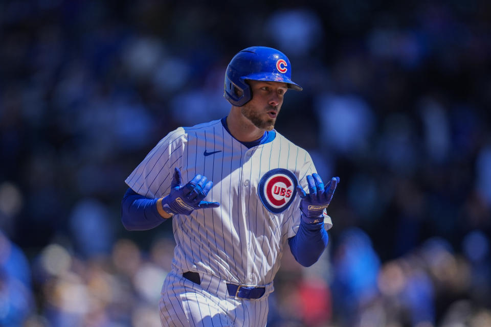 Chicago Cubs' Michael Busch signals to the dugout after hitting a home run during the third inning of a baseball game against the Los Angeles Dodgers, Friday, April 5, 2024, in Chicago. (AP Photo/Erin Hooley)