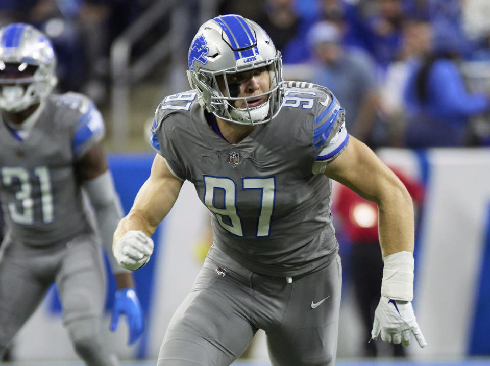 FILE - Detroit Lions defensive end Aidan Hutchinson (97) pursues a play against the Buffalo Bills during an NFL football game, Thursday, Nov. 24, 2022, in Detroit. Travon Walker and Aidan Hutchinson will forever be compared to one another. The top two picks in the 2022 NFL draft will be on the same field for the first time as pros when Detroit hosts Jacksonville on Sunday, a matchup of 4-7 teams that won a combined five games in November and are clinging to slim playoff hopes.(AP Photo/Rick Osentoski, File)