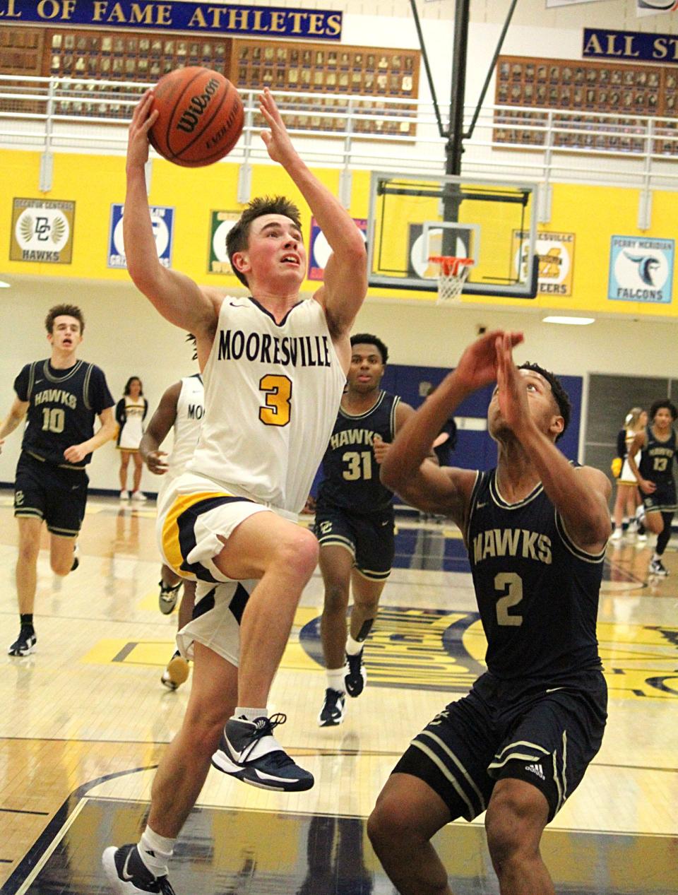 Mooresville senior Zach Woodson goes up for a layup during Friday's Mid-State Conference game against Decatur Central. 