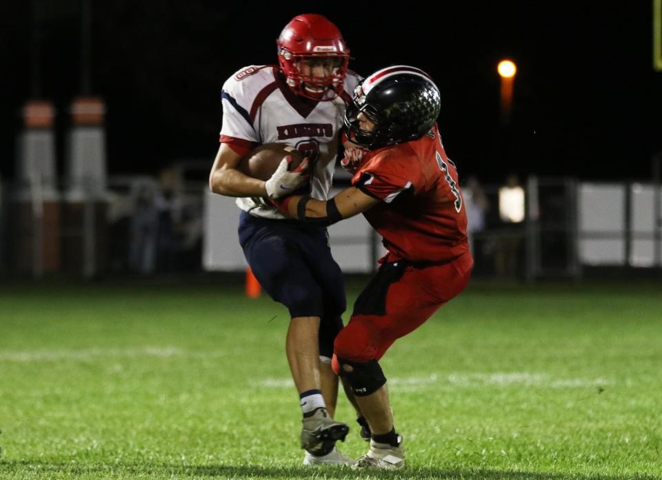 Rosecrans' Weston Hartman tackles FCA's Danny Blair during a game last season. Hartman is one of several players back as the Bishops have higher aspirations after recent struggles in the past few seasons.